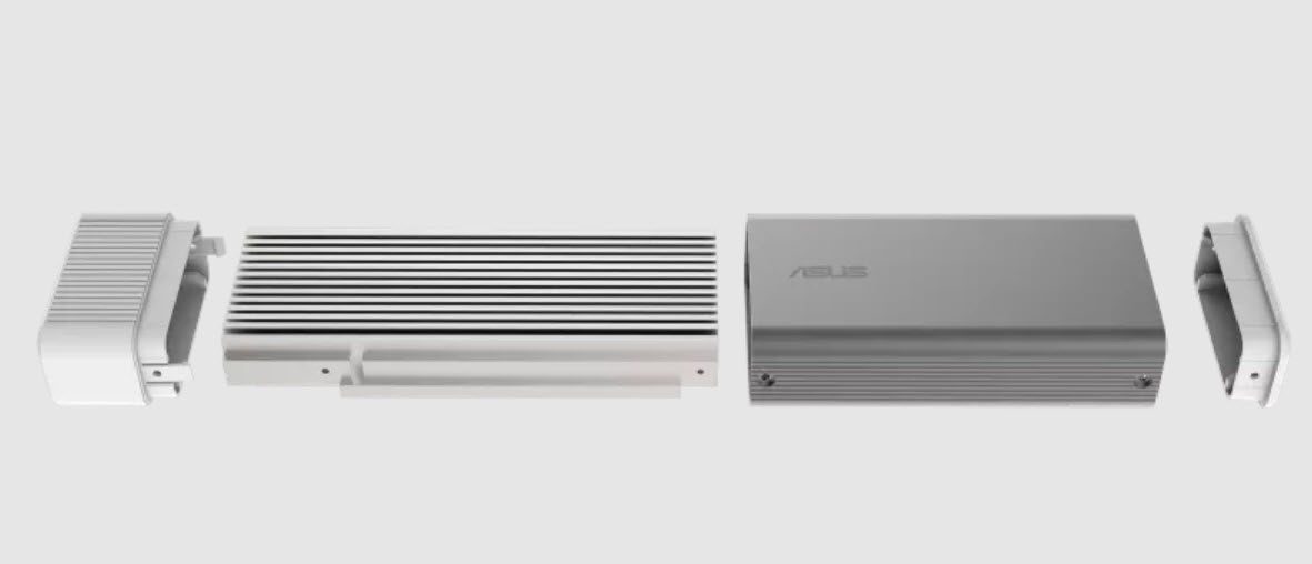 ASUS portable USB AI accelerator attached to a laptop used in a professional office environment